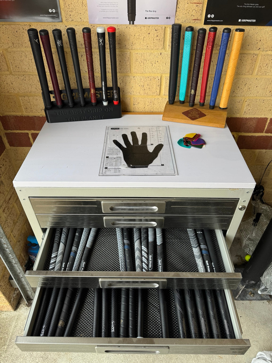 TGCC grip fitting station with grip drawers open